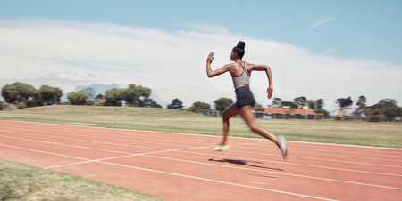 Runner, fitness and fast black woman in stadium for professional race, competition or training....
