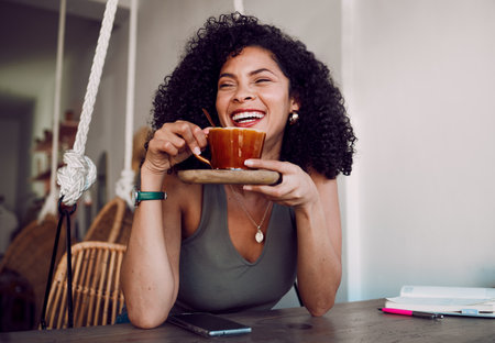 Black woman, coffee and smile for remote work, happy or relax at break or lunch at a cafe table. African American female, freelancer or entrepreneur enjoy tea in restaurant after business successの写真素材