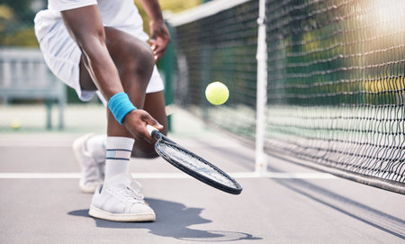 Tennis, fitness and black man hands in an outdoor sports court game doing training and workout. Wellness exercise and cardio energy of an athlete on a tennis court in a professional competitionの写真素材