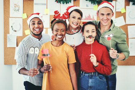 Group of business people, christmas portrait and celebrate festive together in interracial compamy office. Diversity, christmas party and small business team or smile for comic holiday celebrationの写真素材