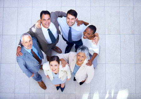 The dream works with teamwork. High angle shot of a business team.の写真素材