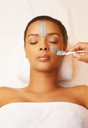 Your skin deserves some pampering. a young woman enjoying a skincare treatment at the spa.