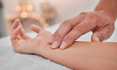 Spa, wellness and hands massage wrist for health, relaxation and pressure relief service zoom. Acupressure, physical therapy and relaxing luxury treatment with professional beauty salon therapist.の写真素材