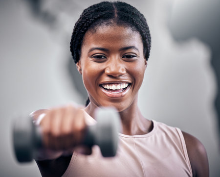 Dumbbell, fitness and black woman in portrait for muscle, power and energy in wellness training mockup. Happy strong sports, athlete and gym girl or african in challenge exercise or workout headshotの写真素材