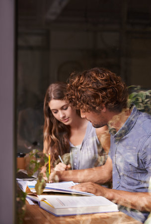 Can we move on. two young students studying in a coffee shop.