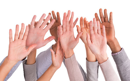 I volunteer. Cropped image of a group of people raising their hands.の写真素材