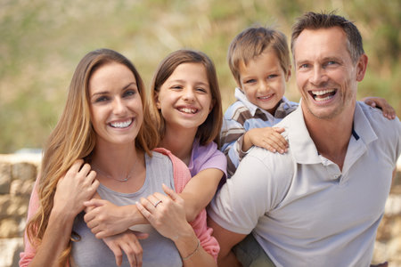 Holiday bonding. Portrait of a family looking happy while on holiday.の写真素材