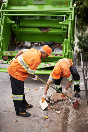 Garbage collection day. a garbage collection team at work.の写真素材