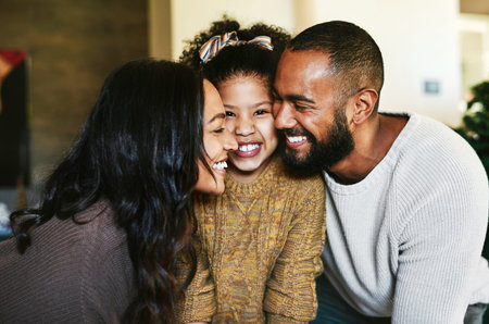 Black family, love and happiness portrait with a mother, father and child together with a smile, support and hug for gratitude. Man, woman and girl daughter bonding in the lounge while happy at homeの写真素材