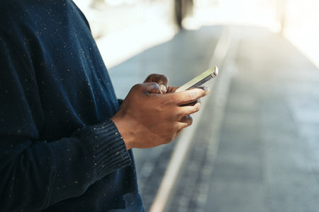 Hands, phone or networking on social media app, internet search or digital iot. Closeup black man with 5g communication technology planning schedule, writing email or using contact us page on websiteの写真素材