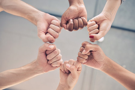 Motivation, teamwork group or collaboration fist bump for trust, goal and success support below....