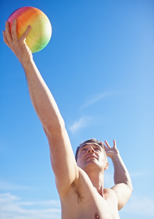 Sand, sun and volleyball. a beach volleyball game on a sunny day.の写真素材