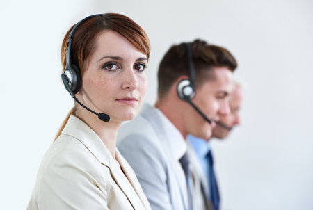 Customer service is our speciality. a beautiful young customer service agent working in an office.の写真素材