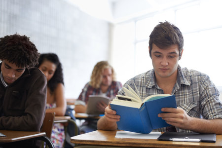 Trying to make get the highest grade. young college student studying.の写真素材