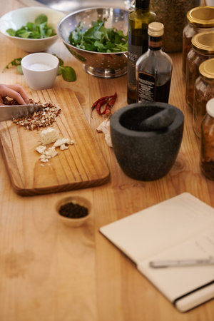 A healthy selection of ingredients for salad. a woman preparing food in a rustic kitchen.