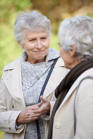 Lending a friendly ear. Senior women smiling and listening to a friend.