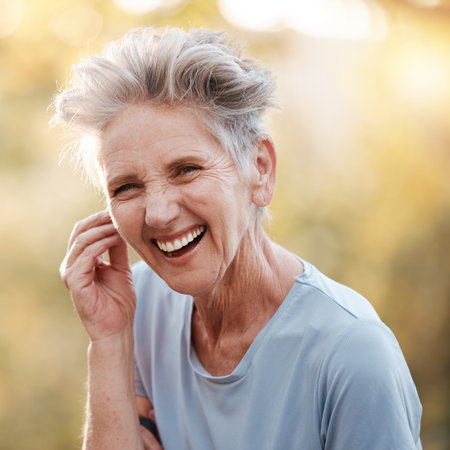 Senior woman, laughing and fitness break in nature park, garden or countryside environment in mobility healthcare, wellness and self care. Smile, happy and comic retirement elderly in exercise restの写真素材