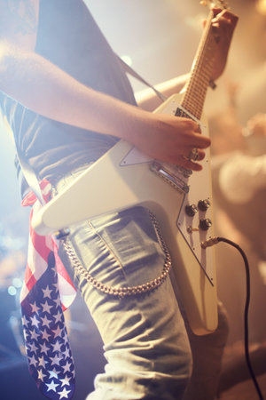Guitar, man and performance in USA at night on stage, party and concert for punk, rock and metal...