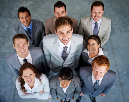 Winners. Top view of a group of smiling young business executives.の写真素材