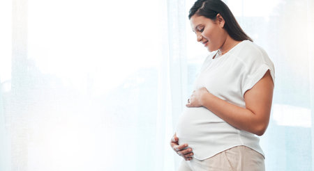 Pregnant woman, stomach and mockup space of mother excited for her future baby. Pregnancy, wellness...