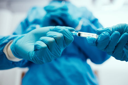 Hands, medical and syringe for surgery, healthcare or wellness in hospital. Closeup, equipment or...