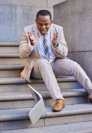 Businessman, laptop and mistake with damage, drop and fail while typing or reading email outdoor in...