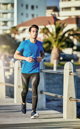 Running can benefit almost every part of your body. a sporty young man out for a run.