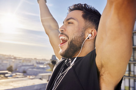Celebrate you. a man celebrating while out for a workout.の写真素材