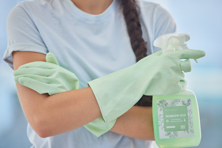Cleaning spray, bottle and woman hands with chemical soap product for bacteria, virus or domestic house work. Home housekeeping service, hygiene and confident worker girl with liquid window cleanerの写真素材