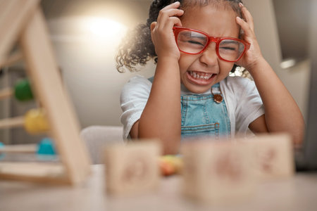Student, frustrated and learning with education and headache, young child with anxiety, mental...