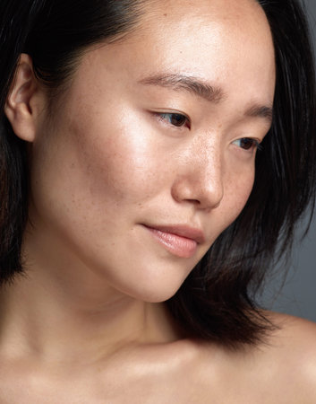 Look at her beautiful complexion. Closeup shot of a beautiful young woman with freckles on her face.の写真素材