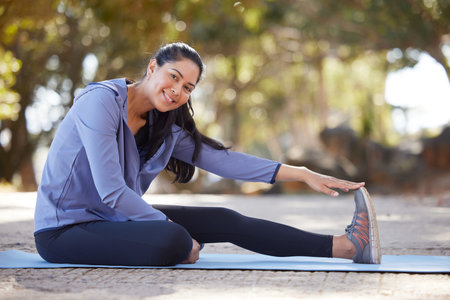Woman portrait, stretching and fitness training, exercise and workout on mat outdoor with happy...