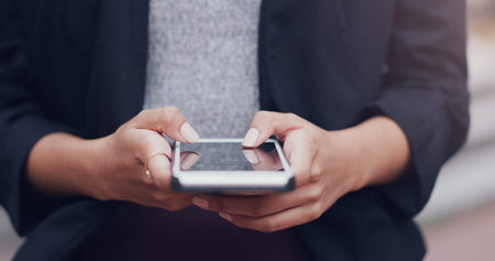 Let me contact a few clients. an unrecognizable businesswoman using a smartphone while standing...