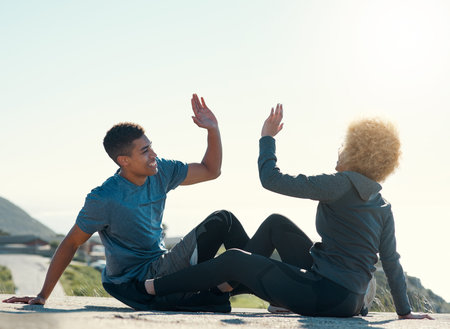 Find someone wholl celebrate small victories with you. a young couple giving each other other five...