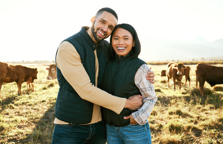 Cow, farm and couple portrait on field in countryside for meat, beef or cattle food industry. Happy people, man and woman farming livestock, cows or animals in agriculture, sustainability and ecologyの写真素材