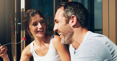 Heres a treat for you. an affectionate mature couple having lunch together outdoors.