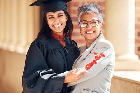 Graduation, student and happy mother portrait of women from India at a graduate ceremony event. College diploma, school celebration and university education certificate of a woman with an achievementの写真素材