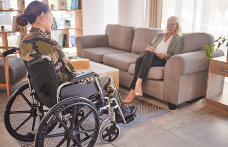 Soldier woman, wheelchair and therapist in talk, rehabilitation or support for war trauma. Psychologist, therapy or military officer for mental health, disability or communication for pain in Ukraineの写真素材