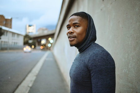 Fitness, workout and black man in the city training for a marathon, race or sport competition....