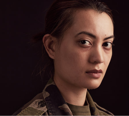 Face, sad woman and crying army soldier with mental health problem, depression and military trauma of psychology on black background. Portrait of depressed Ukraine war veteran with ptsd from serviceの写真素材