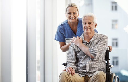 She is the best. Cropped portrait of a mature female nurse and her senior male wheelchair-bound patient in the hospital.の写真素材
