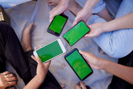 Top view, hands or people with green screen phones for social media app, internet esports game or...