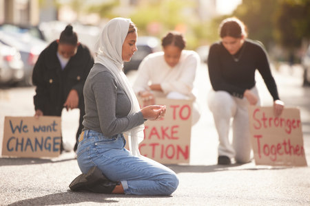 Protest, Islamic woman and pray in street, group and support for Palestine. Muslim female, girl or protesters with cardboard signs, fight for justice or change in society for oppression or solidarityの写真素材