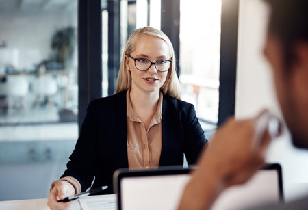 Every time they meet they make corporate magic. a young businessman and businesswoman having a discussion in the boardroom of a modern office.の写真素材