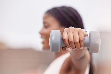 Fitness, sports or black woman with dumbbell for strong arms, bicep muscles or powerful shoulders in...