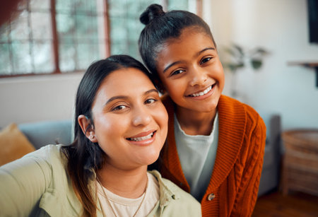 Portrait, mother and girl take a selfie for social media content as a happy family at home during...