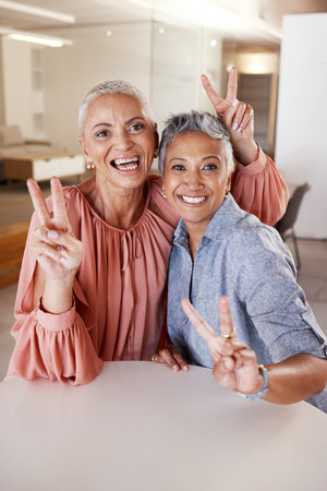 Senior women, bonding or peace sign in house or home living room for social media, profile picture or cool memory capture. Portrait, happy smile or retirement elderly friends and emoji hands gestureの写真素材