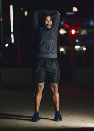Black man, outdoor and stretching at night, fitness and exercise for health, body care and balance....