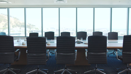 Business meeting room, office space interior or corporate workplace design for marketing or advertising background. Architecture, furniture and window of company boardroom with luxury chair and tableの写真素材