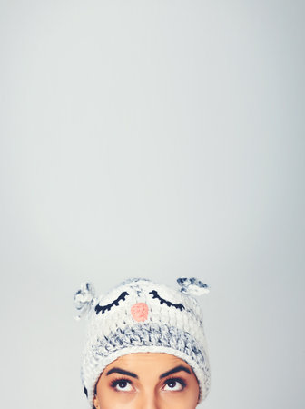 I just love character beanies. a young woman posing with a character beanie.の写真素材